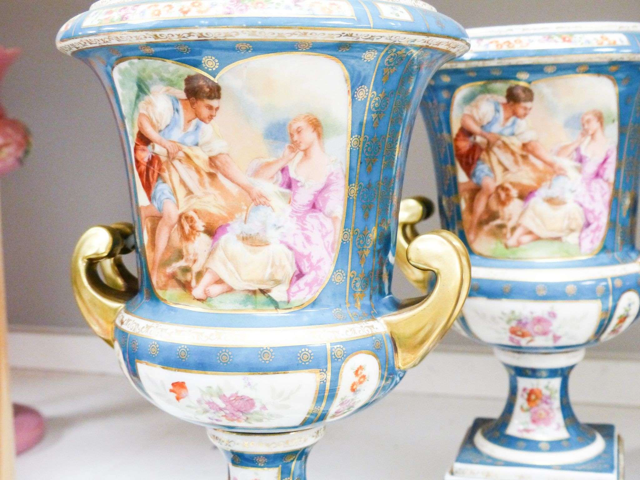 Two Vienna style porcelain chargers, 38cm and a similar pair of pedestal vases, 29cm, early 20th century